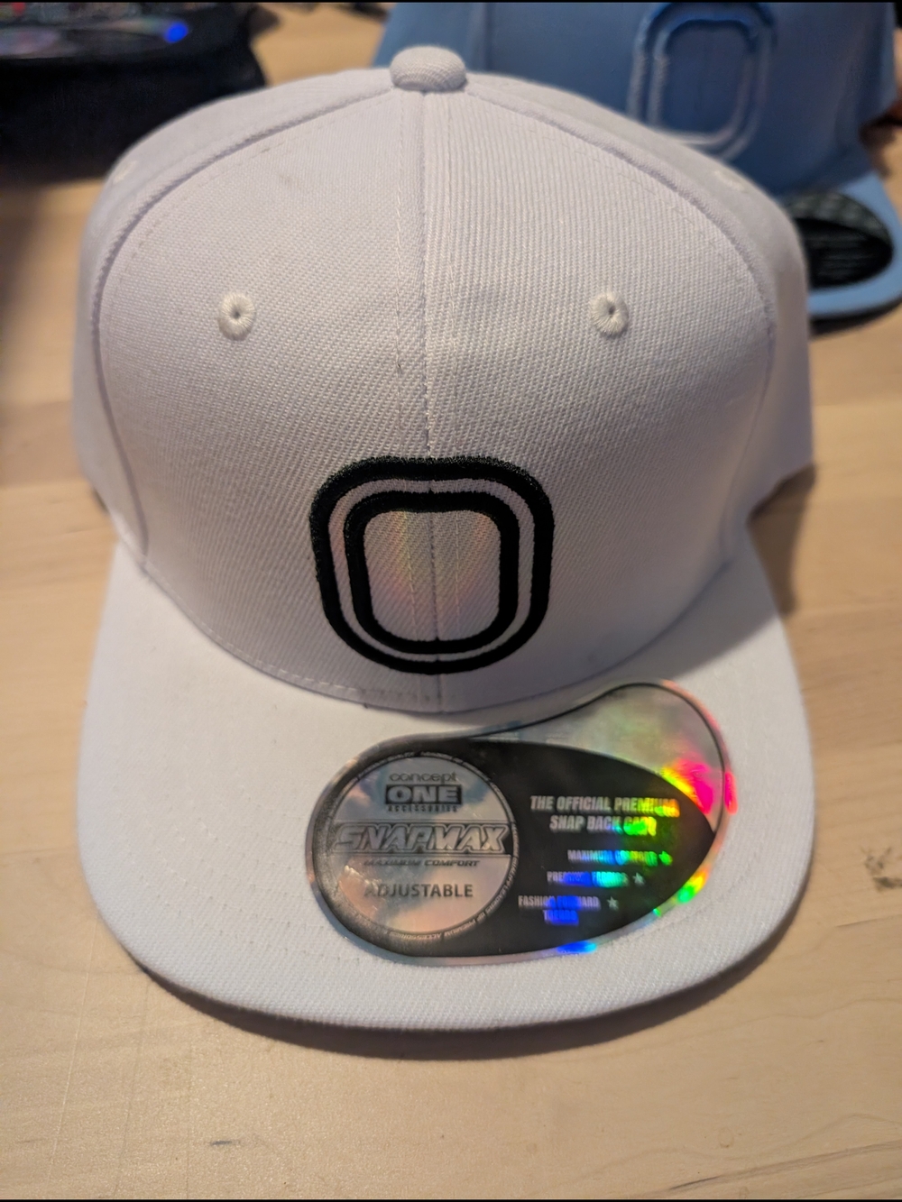 White Snapback Hat with Black O Logo